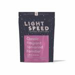 Luna Nueva specialty-grade Mexican coffee with nutty, cedar, clove, and tamarind flavors in a dark purple and pink Light Speed Coffee Roasters bag